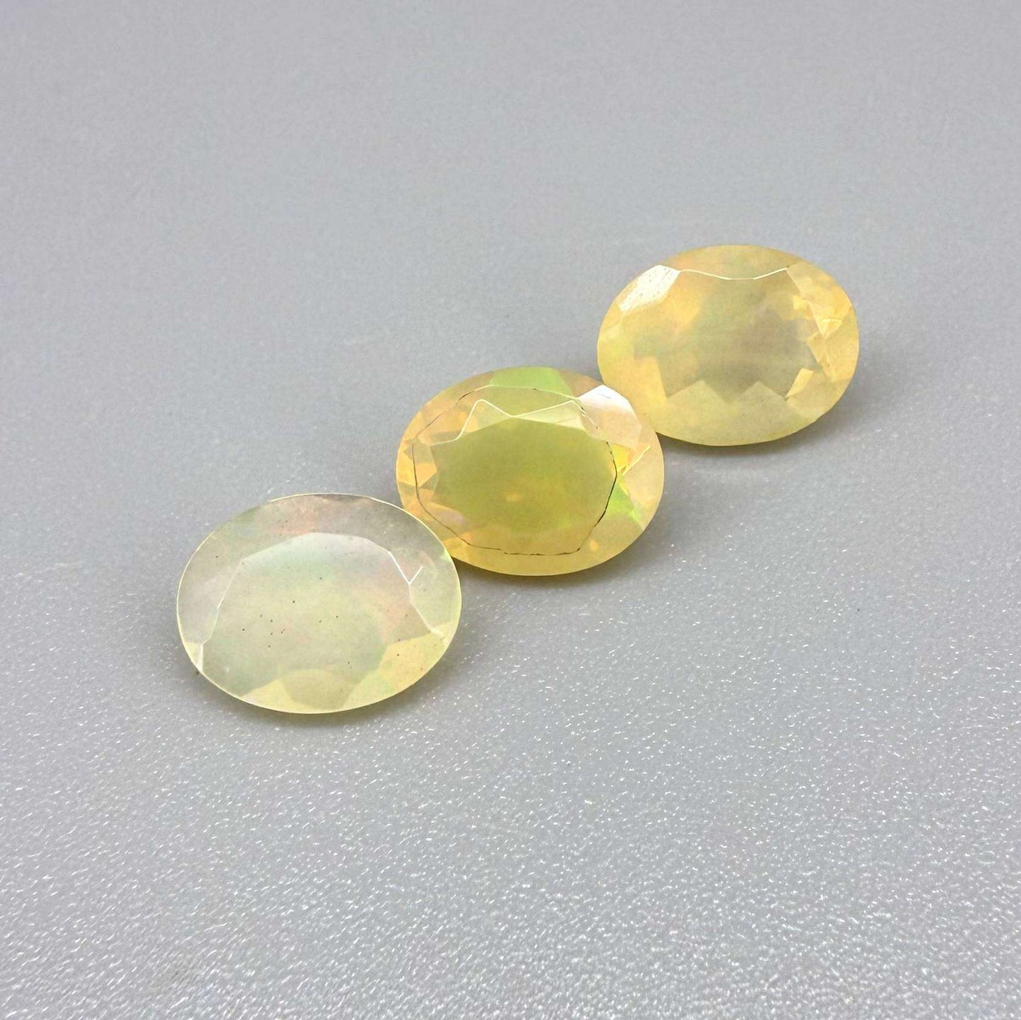 Natural Milky Yellow play-of-color Opal gemstone set, oval cut
