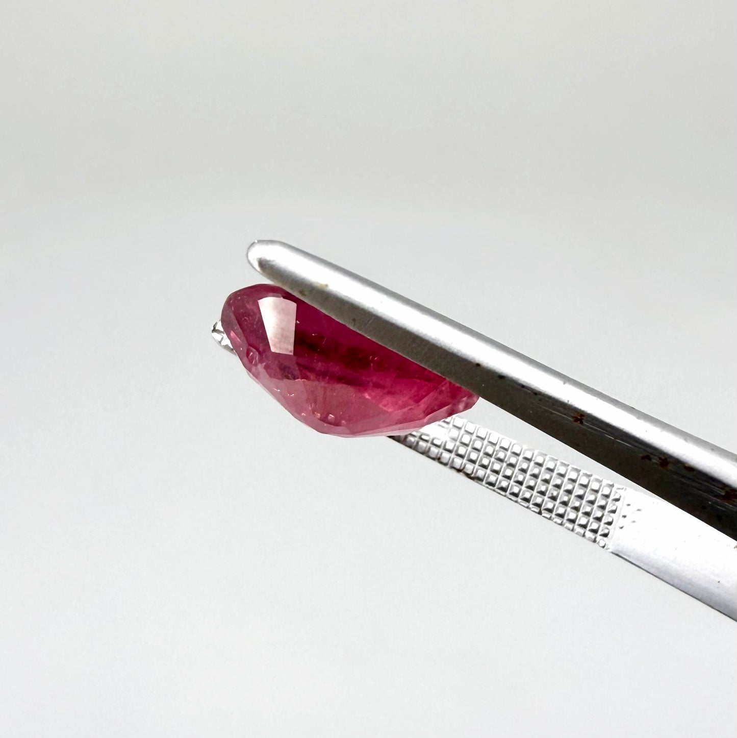 Natural Ruby 4.91 ct from Mozambique – treated oval faceted gemstone with vivid pinkish-red color