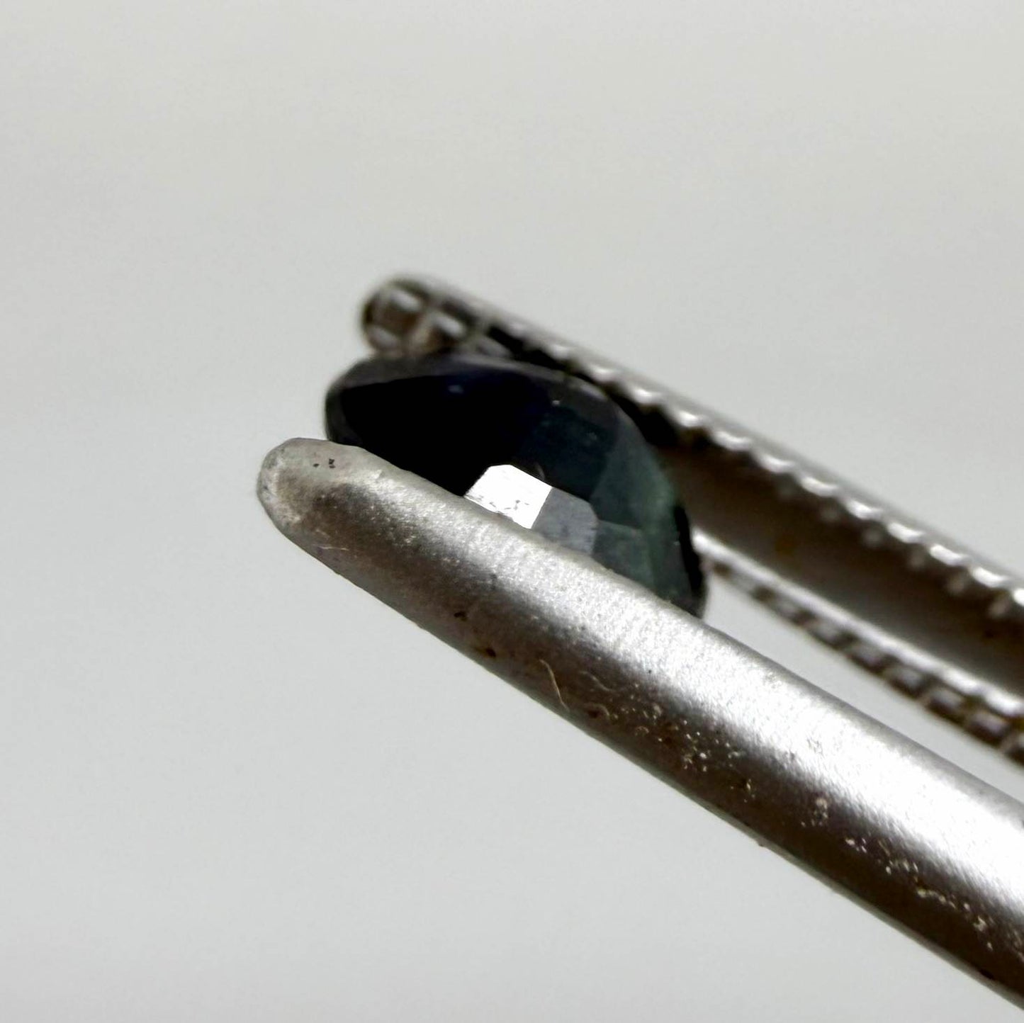 0.34 ct natural deep teal Laos sapphire with oval faceted cut and rich teal colour