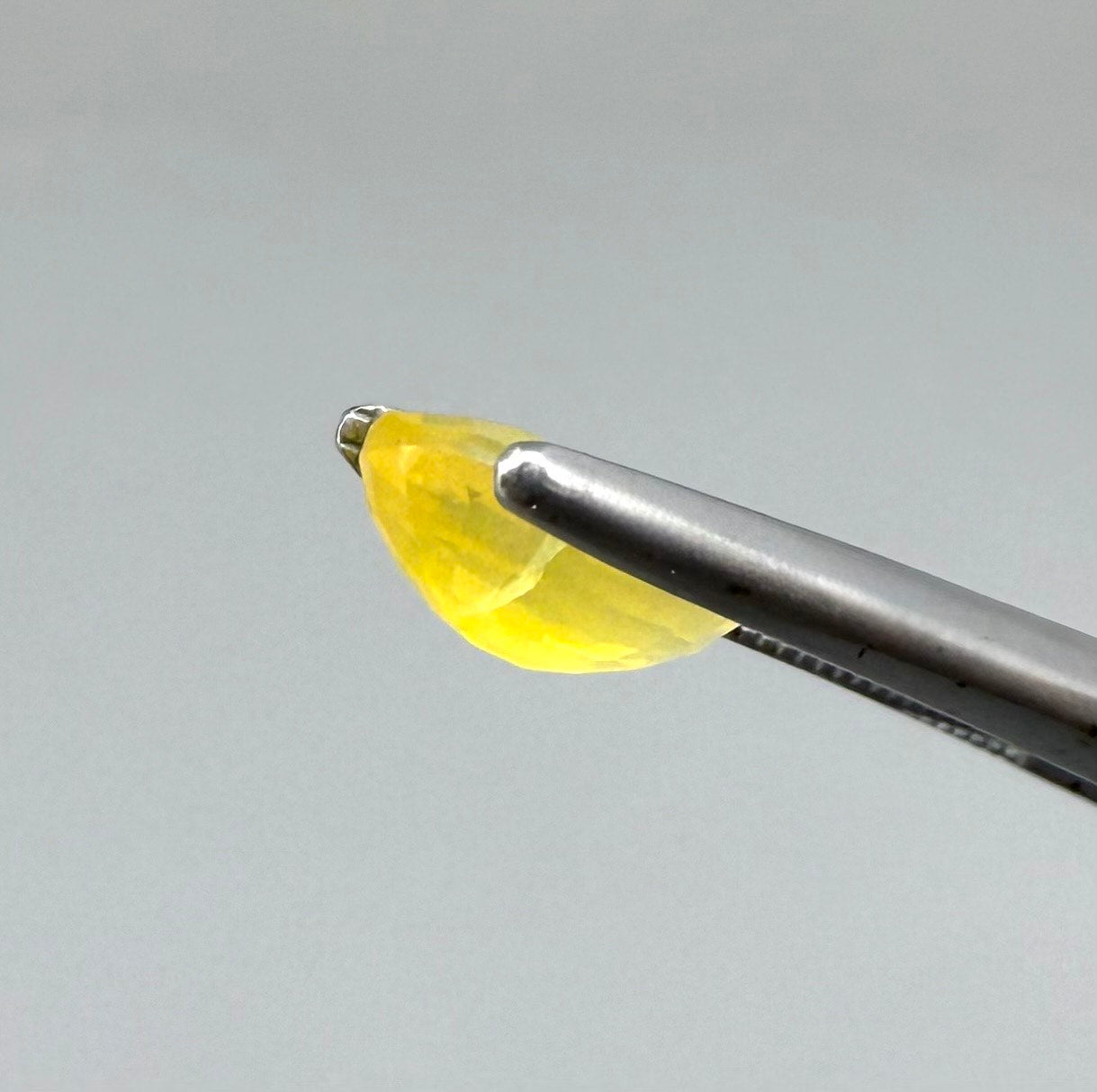 0.84 ct natural yellow opal from Africa, polished gemstone.