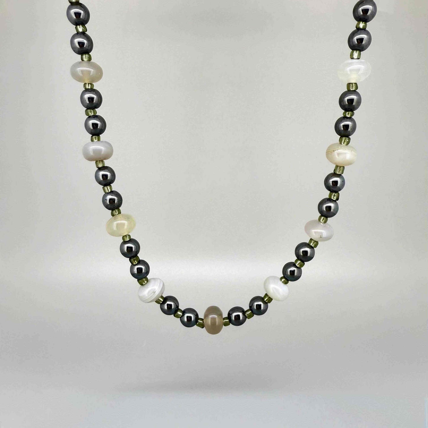 Quartz and hematite necklace, 44 cm / 17.3 in, featuring alternating clear quartz and metallic grey hematite beads.