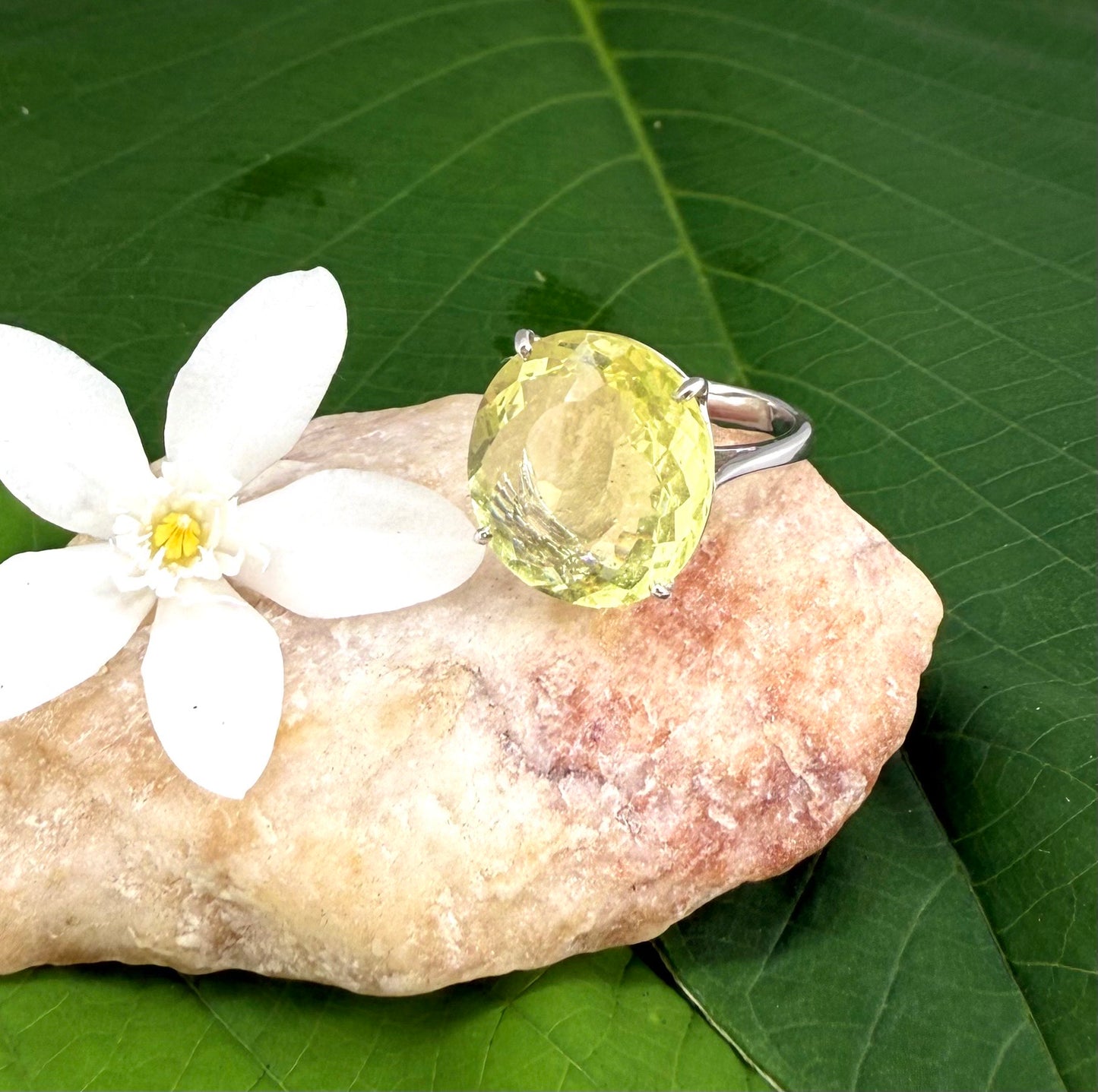 Lemon quartz ring in white gold plated sterling silver, featuring a faceted soft yellow gemstone with brilliant clarity, elegant and timeless design.