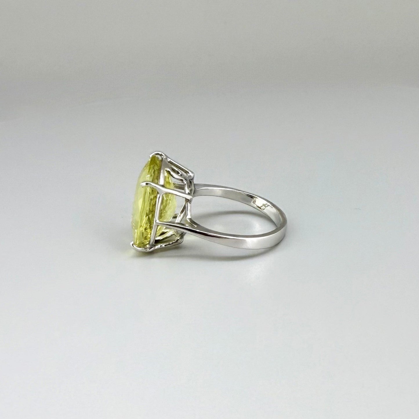 Lemon quartz ring in white gold plated sterling silver, featuring a faceted soft yellow gemstone with brilliant clarity, elegant and timeless design.