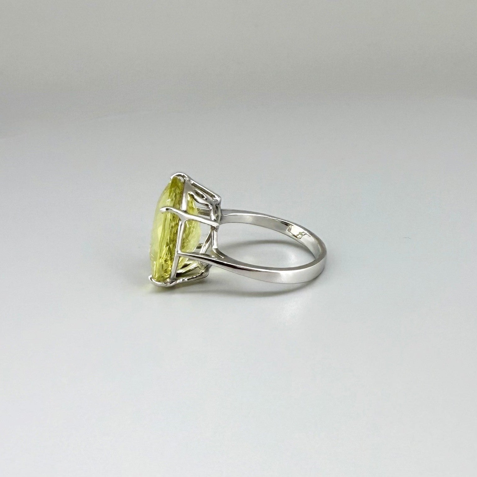 Lemon quartz ring in white gold plated sterling silver, featuring a faceted soft yellow gemstone with brilliant clarity, elegant and timeless design.