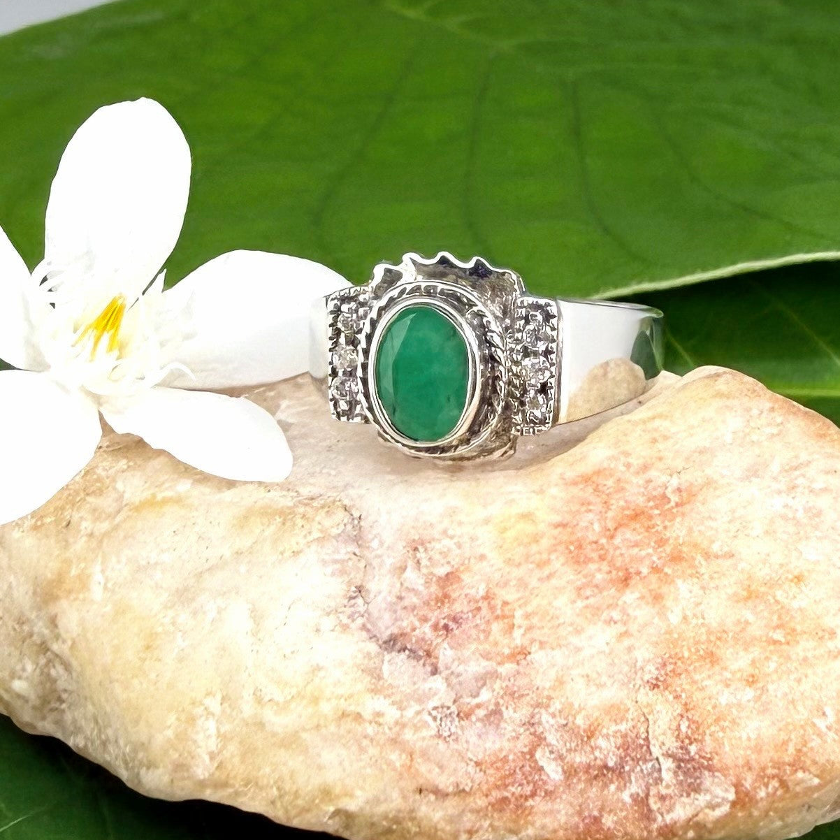 Green quartz cabochon ring in white gold plated sterling silver, featuring an oval vivid green gemstone with soft translucent glow and refined silver design.