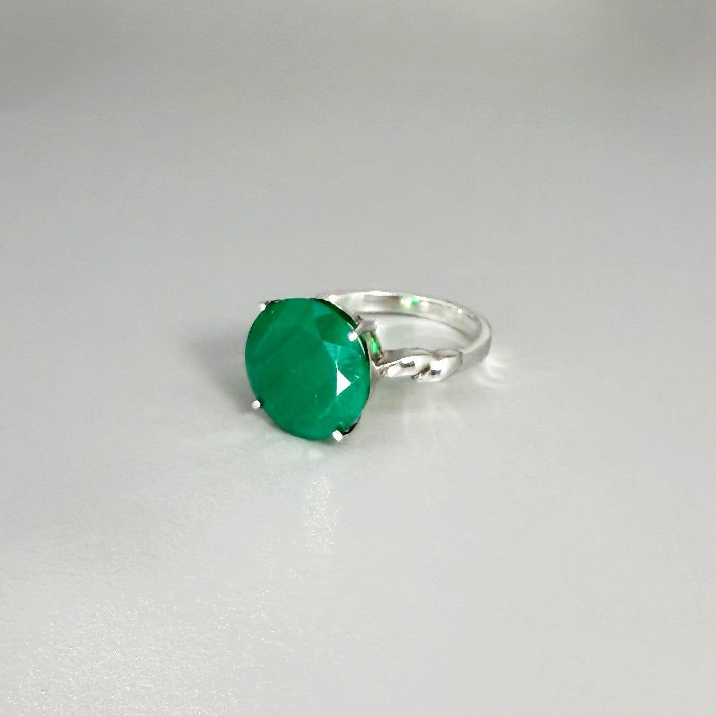White gold plated sterling silver ring with polished round green agate gemstone, elegant solitaire design with natural shine.