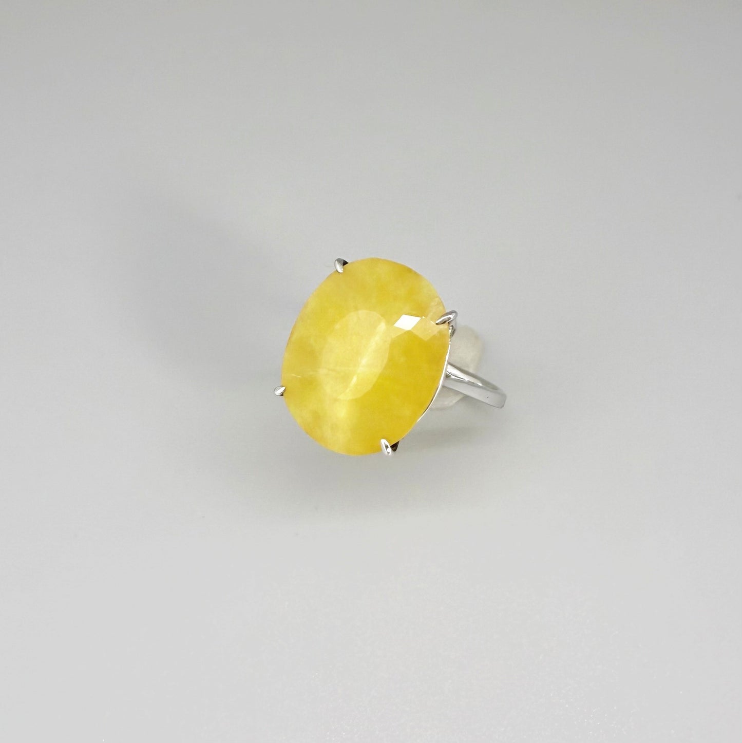 Yellow opal ring in white gold plated sterling silver, featuring a smooth natural gemstone with soft glow, elegant and refined design.