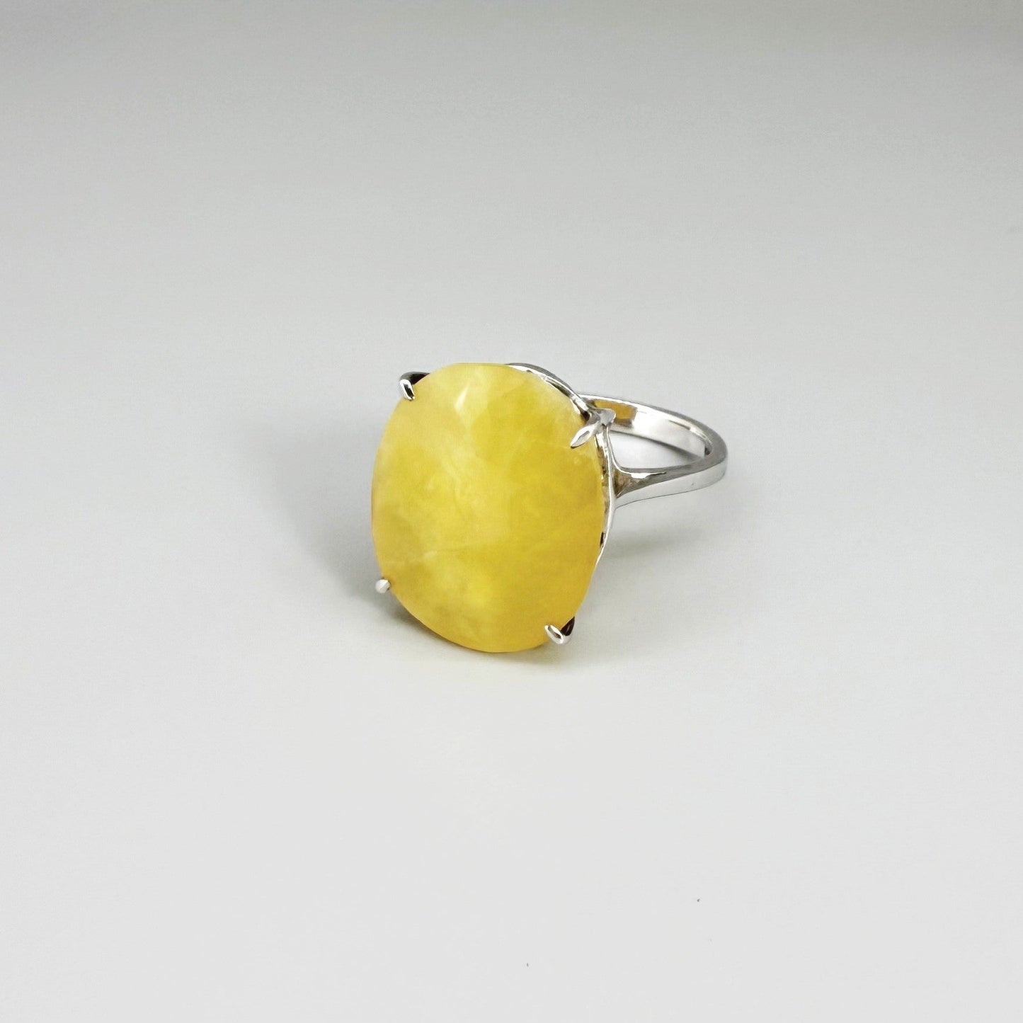 Yellow opal ring in white gold plated sterling silver, featuring a smooth natural gemstone with soft glow, elegant and refined design.