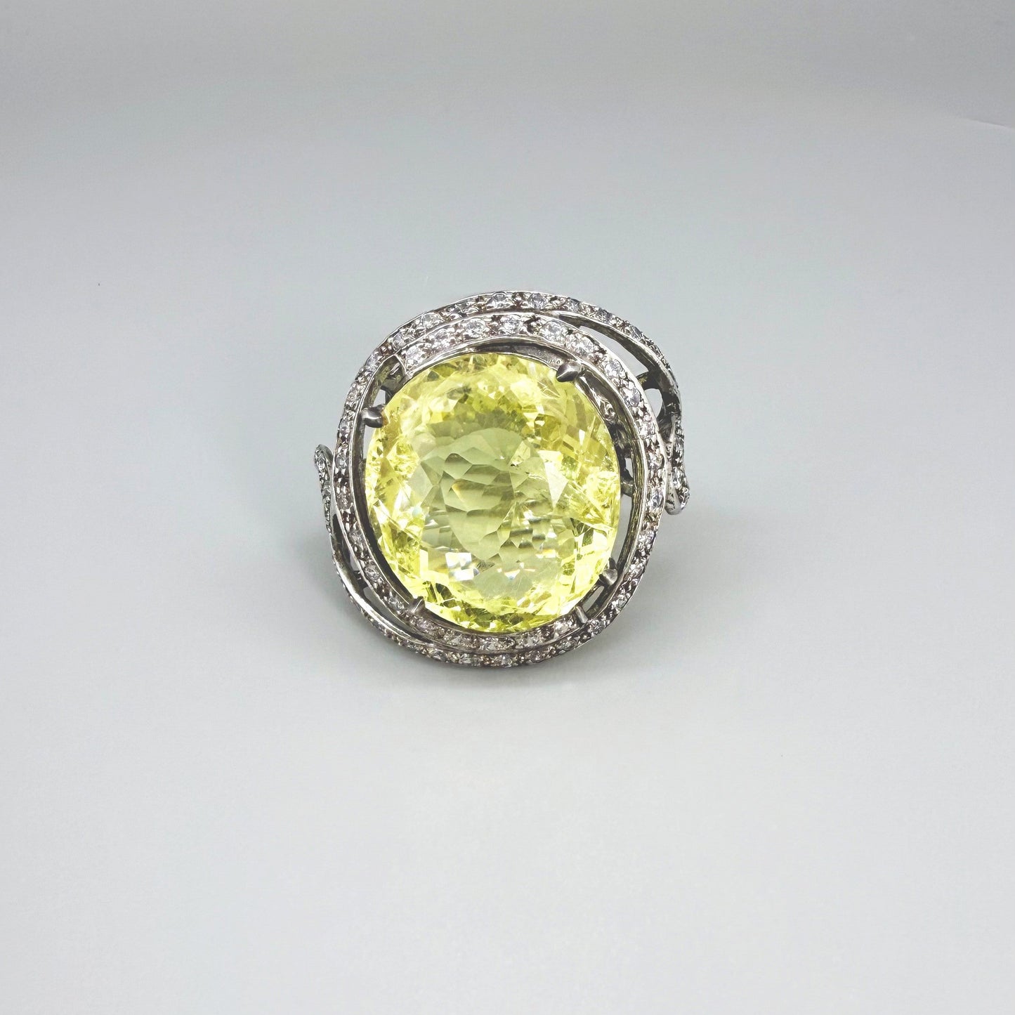 Lemon quartz and CZ ring in white gold plated sterling silver, featuring a faceted yellow gemstone framed by clear cubic zirconia, elegant and radiant design.