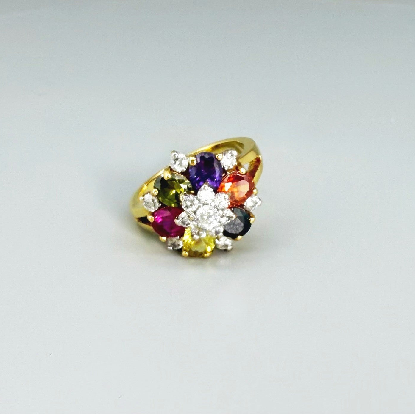 Tourmaline cluster ring in gold plated sterling silver, featuring faceted pink, green, and yellow gemstones, elegant and colorful design.