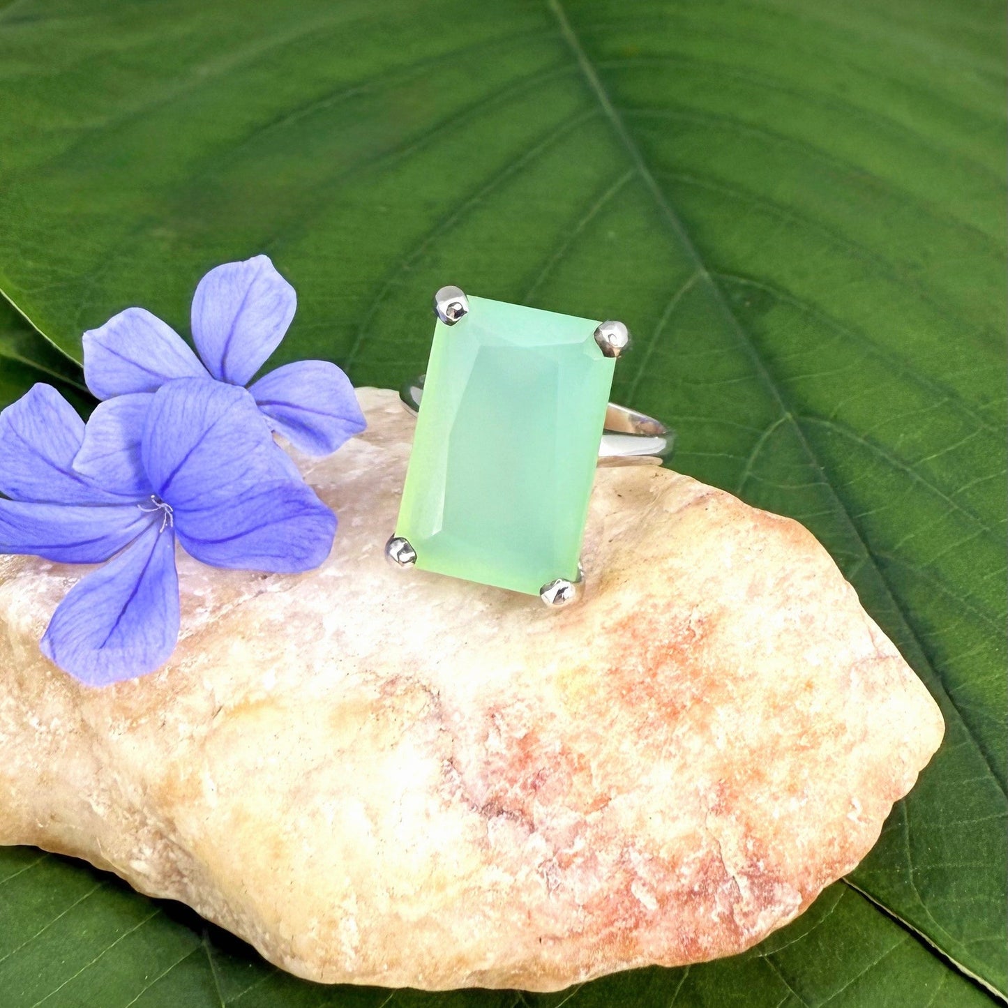 Green chalcedony ring in white gold plated sterling silver, featuring a rectangular-cut soft mint green gemstone with gentle translucence, elegant design.