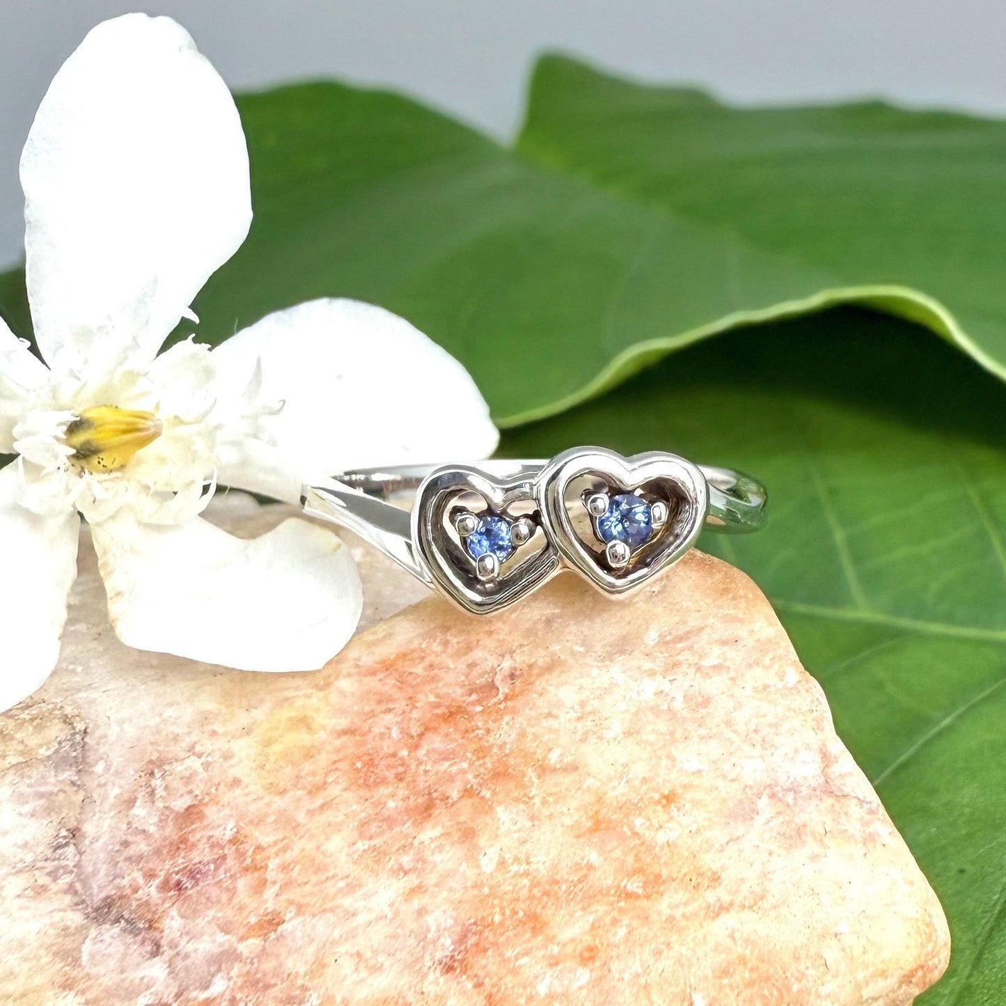 Delicate sapphire ring in white gold plated sterling silver, featuring natural blue gemstones in a graceful setting, elegant and timeless design.