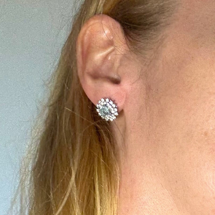 Aquamarine and cubic zirconia stud earrings in white gold plated sterling silver with butterfly backs.