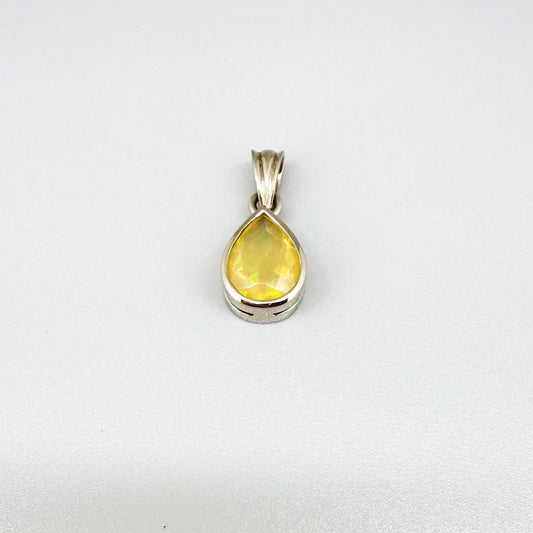 Handmade white gold plated silver pendant with 14.76 ct rose quartz and cubic zirconia accents, elegant and refined design.