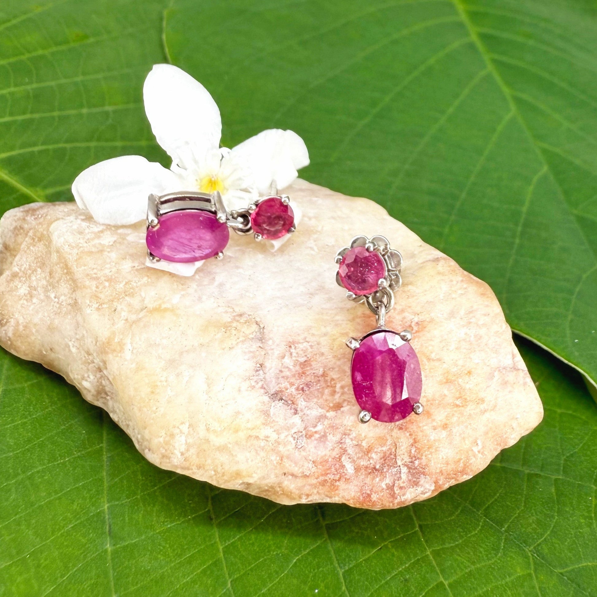 Ruby drop earrings in white gold plated sterling silver with natural pink rubies.
