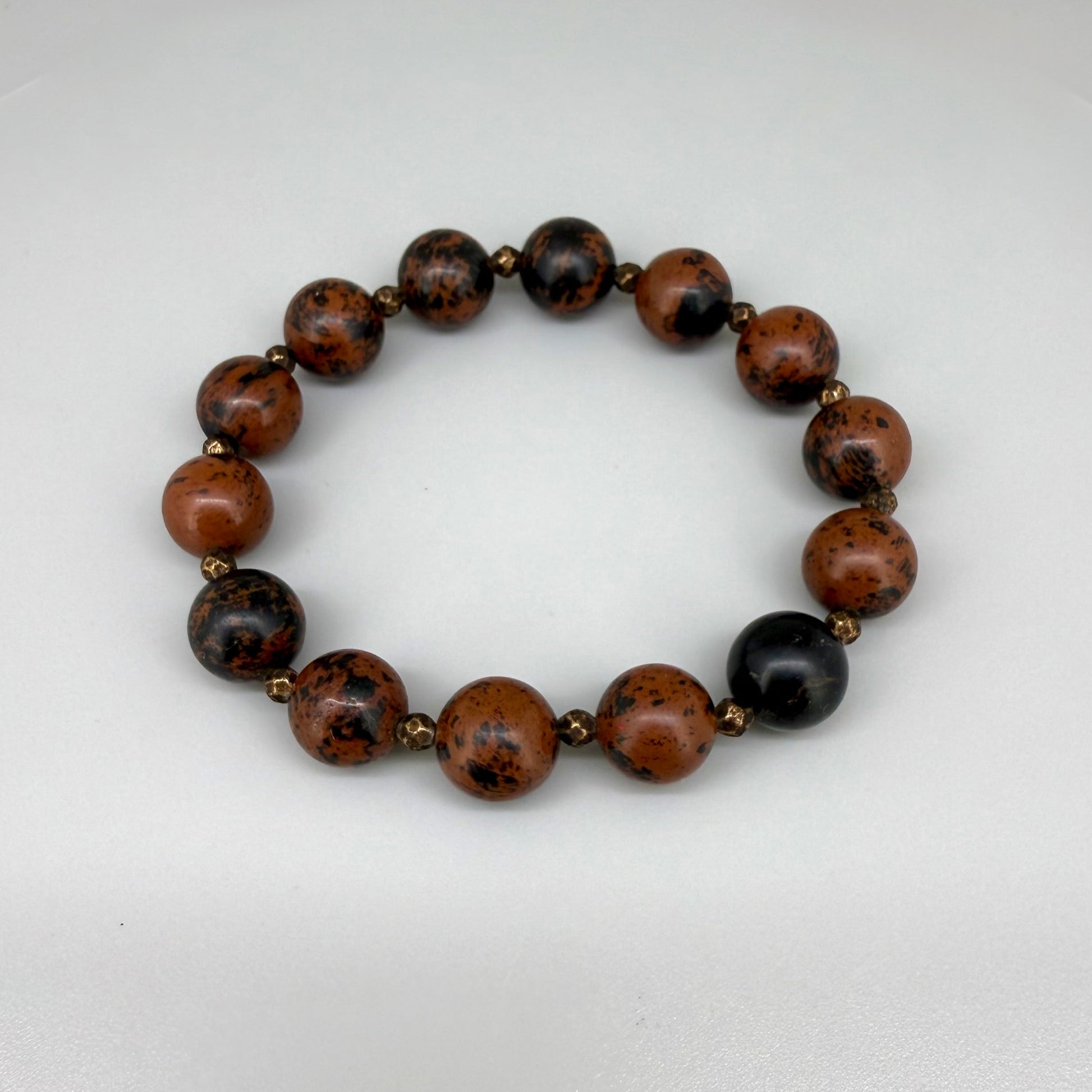 Mahogany obsidian beaded bracelet, 17cm, natural brown and black gemstone beads with small copper accents on elastic stretch band.