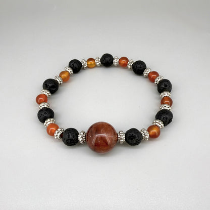 Alt-Text

Carnelian, lava, and cherry quartz beaded bracelet, 18cm, natural orange-red, matte black, and pink beads on elastic stretch band.
