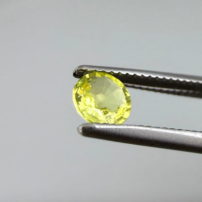 0.28 ct natural yellow sapphire from Bangkaja, round cut.