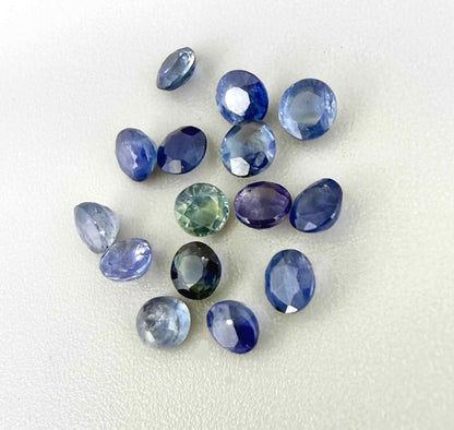 2.8 ct natural sapphire lot from Bangkaja with blue, green and purplish hues, round cut stones.