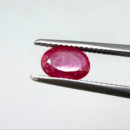 0.5 ct natural pink-red Songea ruby, oval cut.