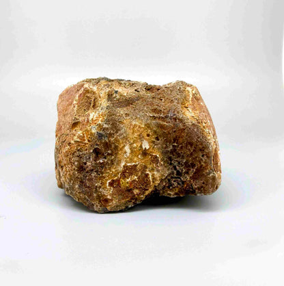 Natural red chalcedony rough (quartz) with warm orange to deep red tones, uncut gemstone.