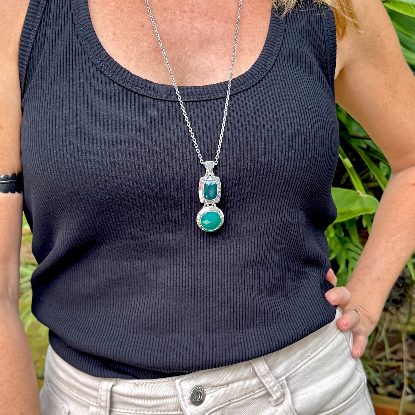 Handcrafted white-gold-plated silver pendant with two green chalcedony stones (16.47 ct total) in a modern geometric design.