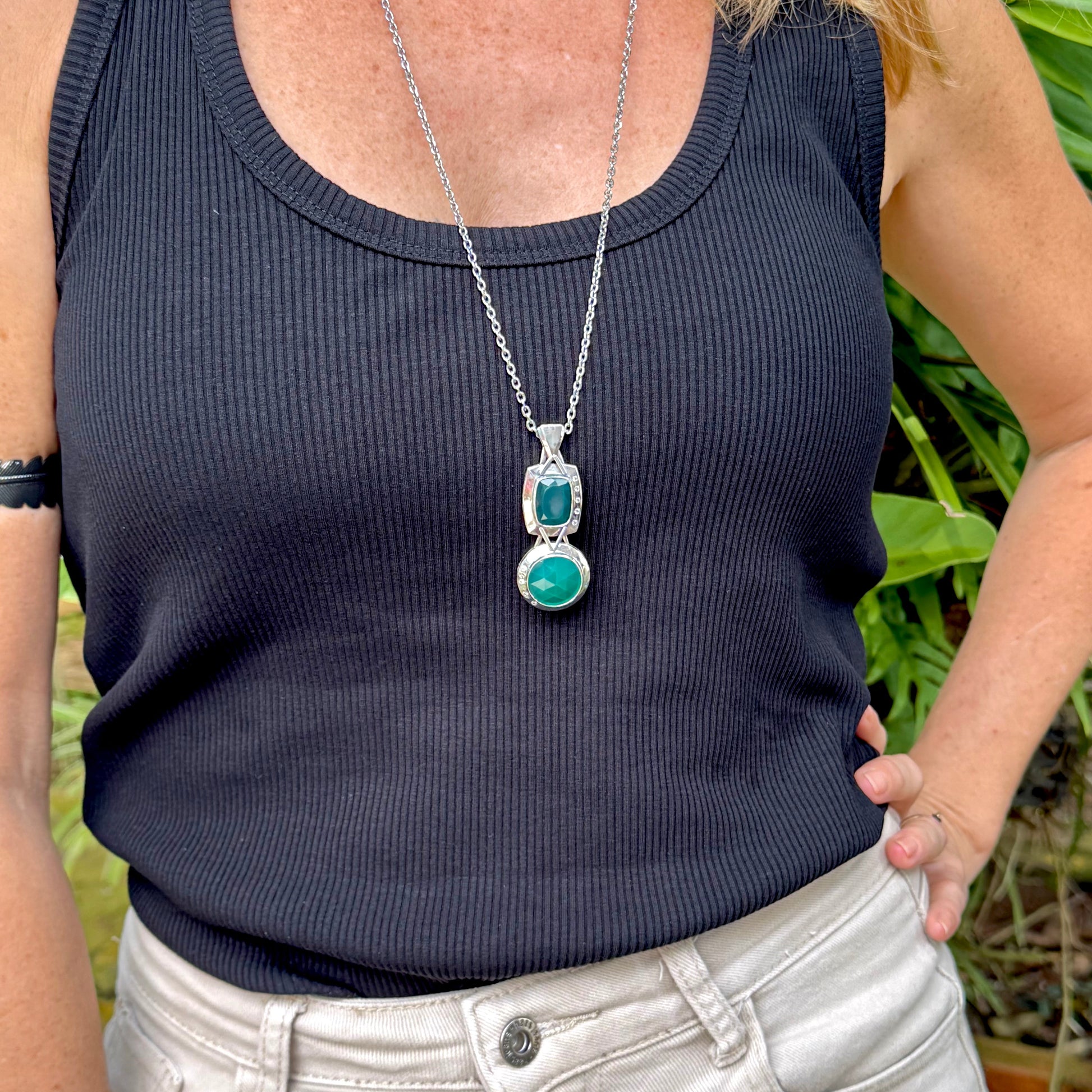 Handcrafted white-gold-plated silver pendant with two green chalcedony stones (16.47 ct total) in a modern geometric design.