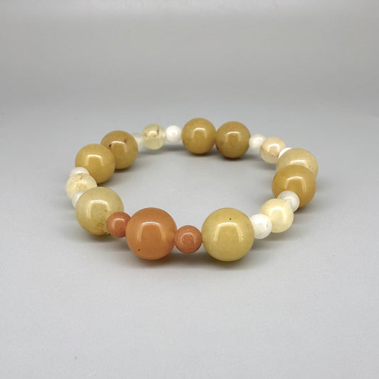 Jade beaded bracelet, 18cm, natural gemstone beads in yellow-cream, orange, and white tones on elastic stretch band.