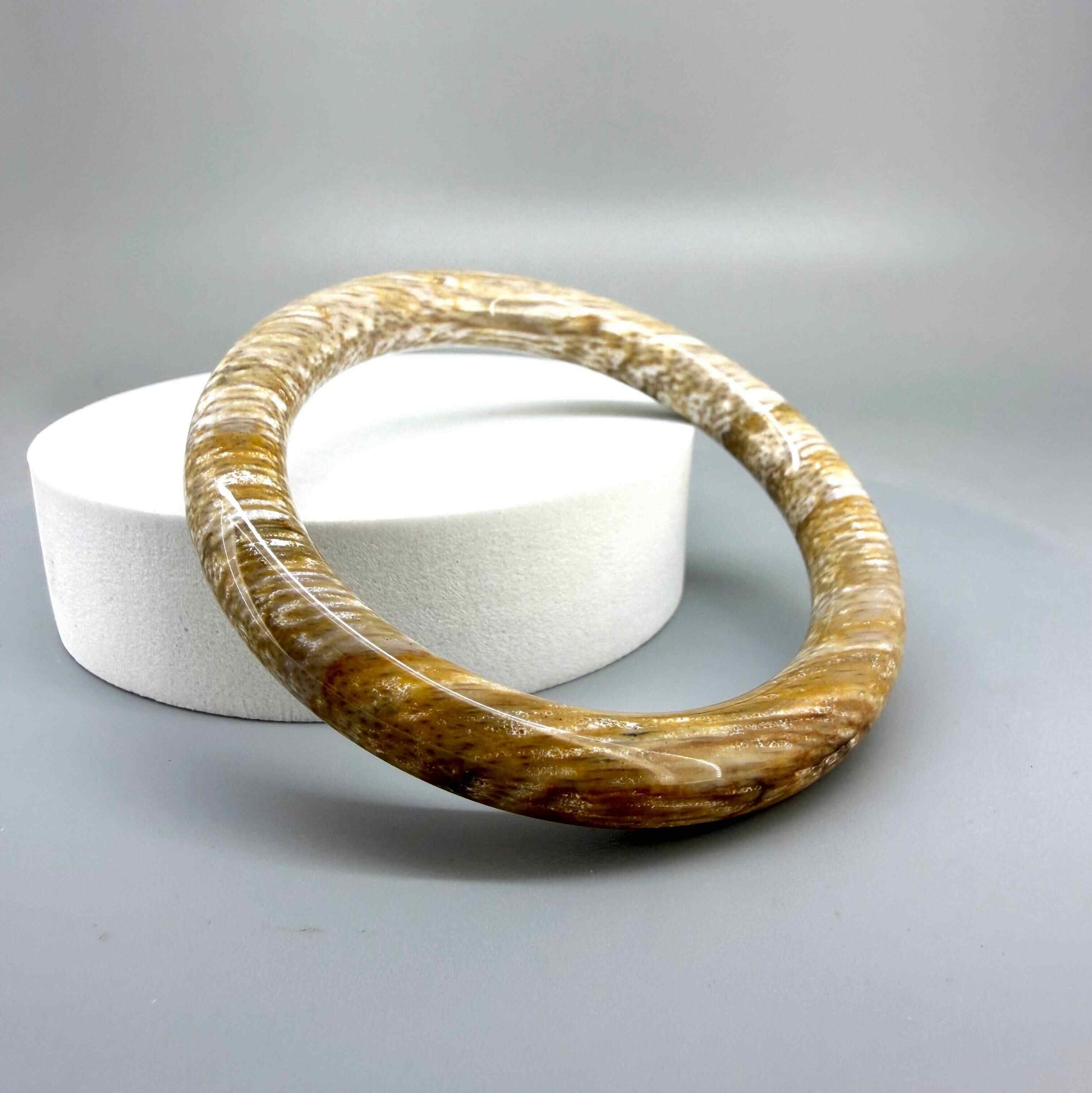 Solid petrified wood bangle with polished surface, 19 cm