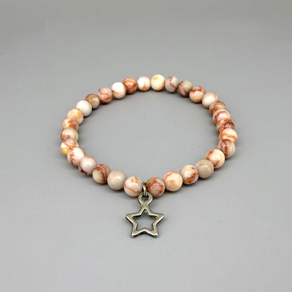 Orange-beige jasper beaded bracelet, 17cm, natural gemstone beads with star charm on elastic stretch band.
