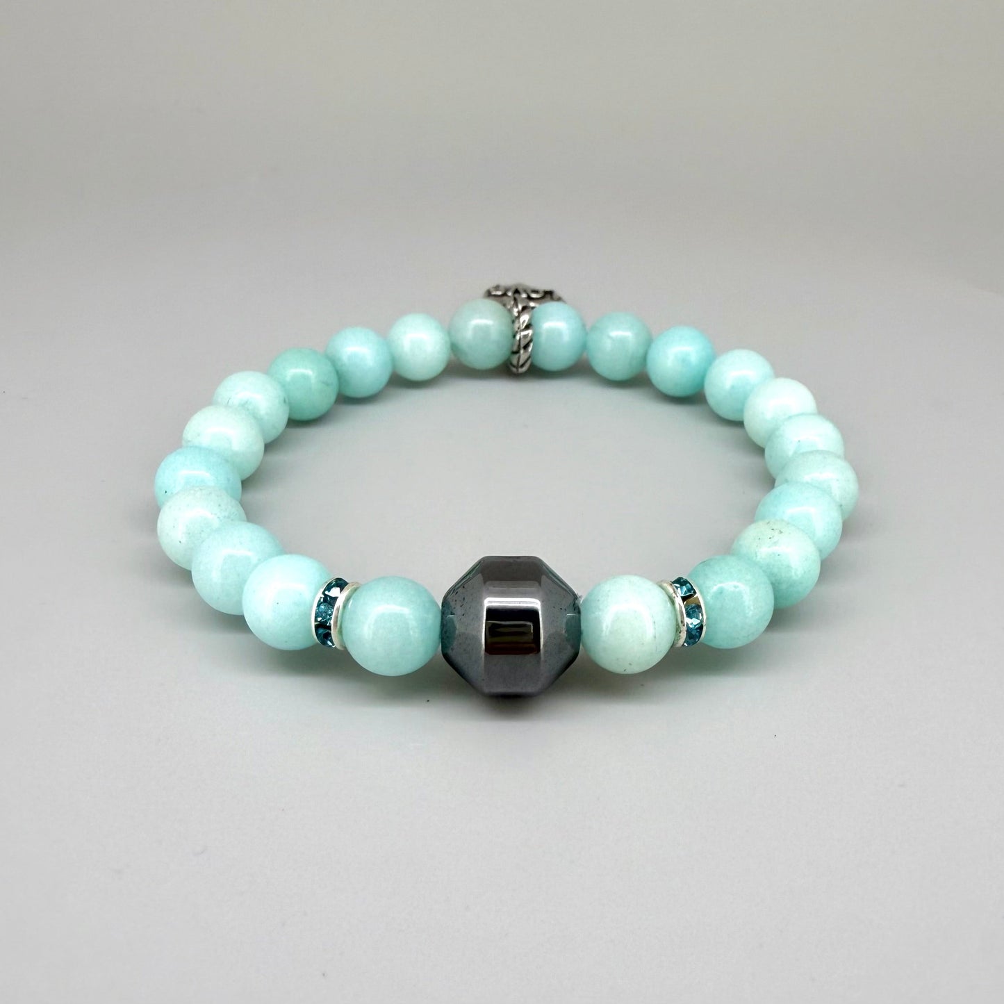 Agate beaded bracelet, 19cm, aqua-blue gemstone beads with decorative medallion accent on elastic stretch band.