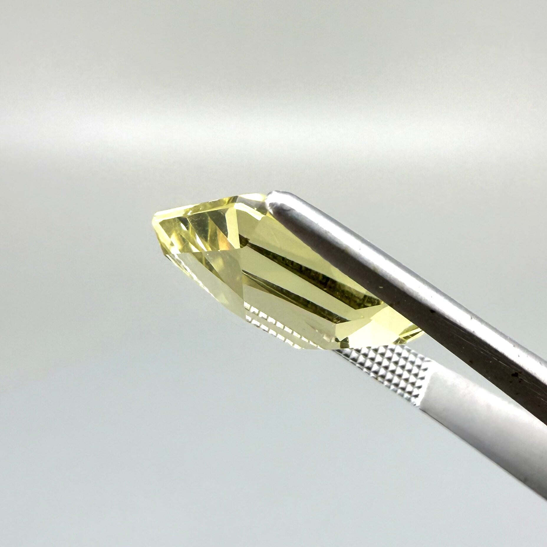 5.6 ct natural lemon quartz, faceted with bright yellow color.