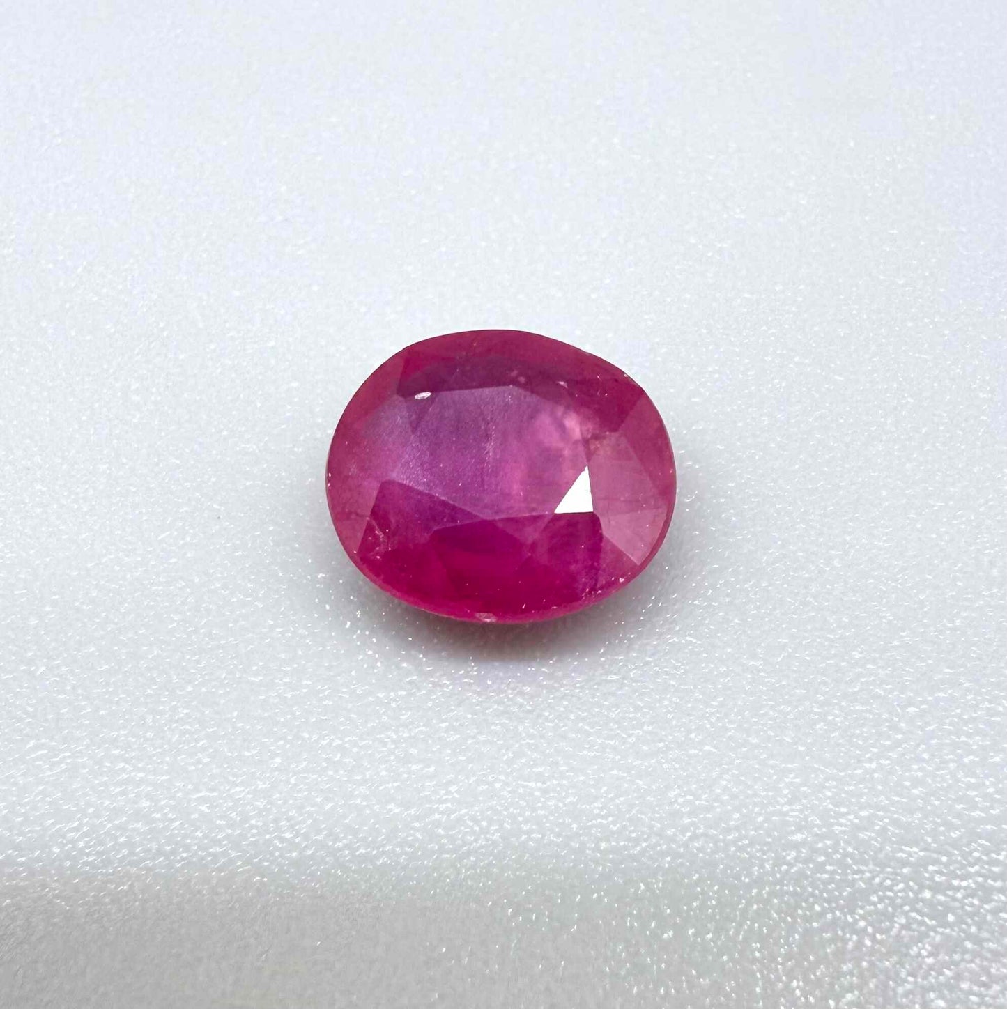 2.5 ct natural pink-red Mozambique ruby, oval cut.