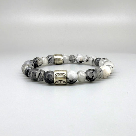 Rutilated quartz beaded bracelet, 18cm, black-white-grey gemstone beads with two decorated metal spacers on elastic band.