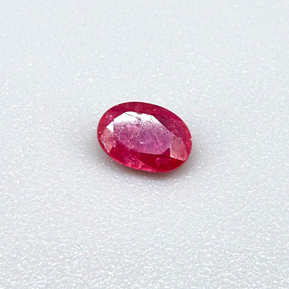 0.5 ct natural pink-red Songea ruby, oval cut.