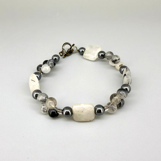 Rutilated quartz and hematite beaded bracelet, natural gemstone beads with toggle clasp.