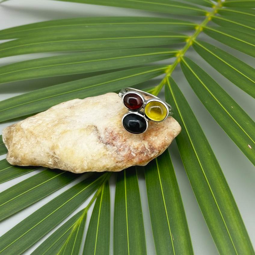 Handmade sterling silver ring with citrine, garnet and cat’s eye gemstones.