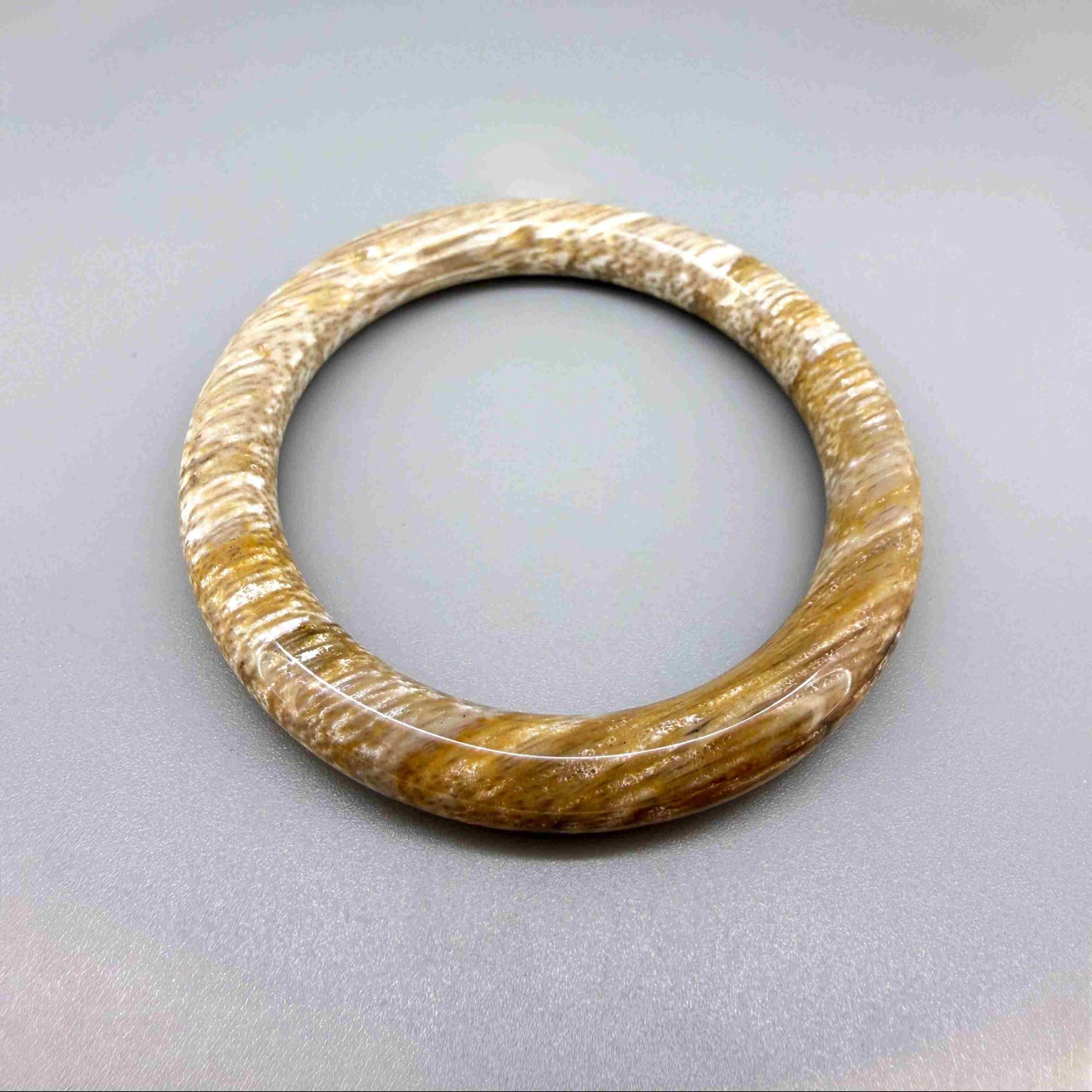 Solid petrified wood bangle with polished surface, 19 cm