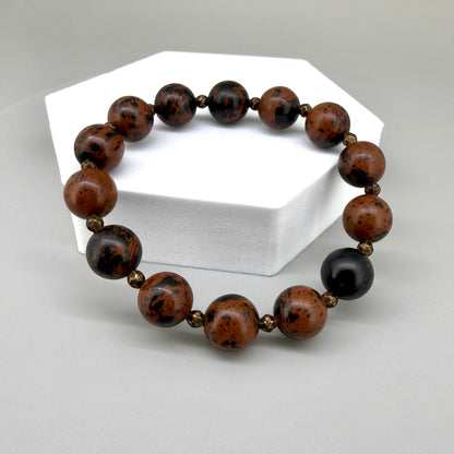 Mahogany obsidian beaded bracelet, 17cm, natural brown and black gemstone beads with small copper accents on elastic stretch band.