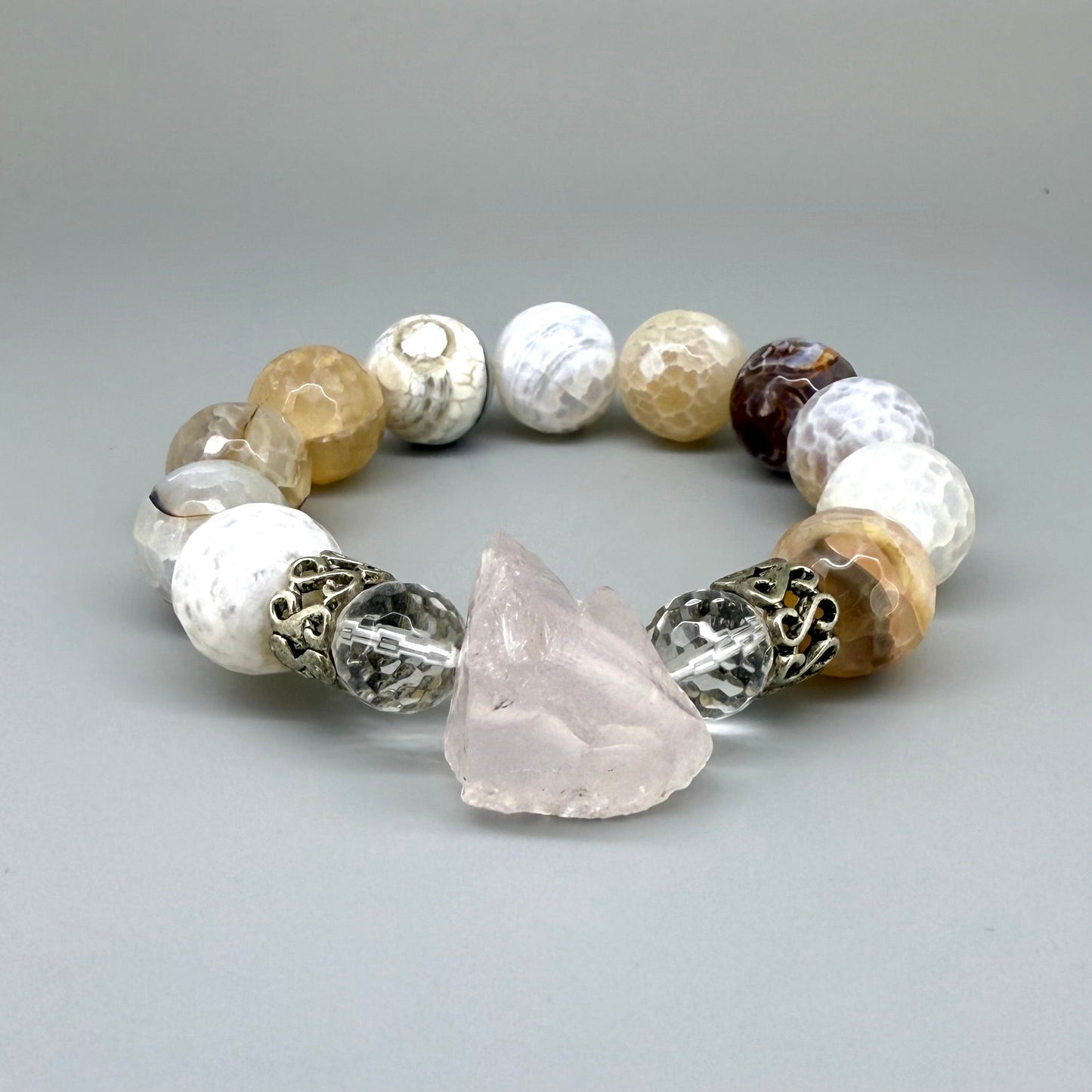 Dragon vein agate beaded bracelet, 18cm, beige-brown patterned gemstone beads with carved rose quartz focus stone and silver accents on elastic stretch band.