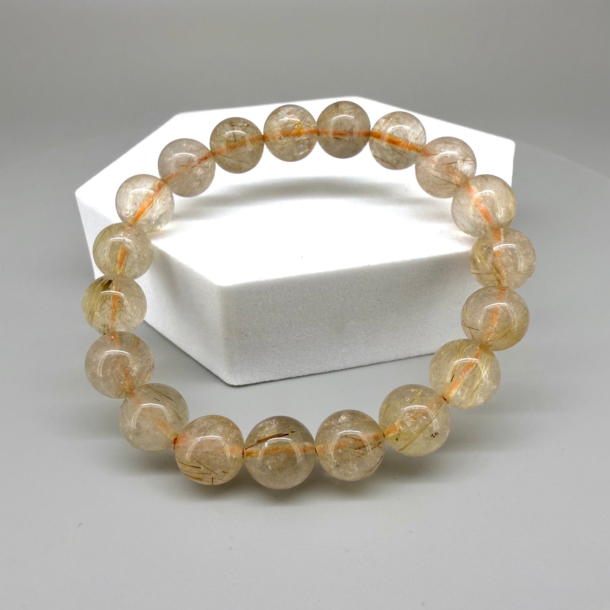 Bronze rutilated quartz beaded bracelet, 18cm, natural gemstone beads with bronze rutile threads on elastic stretch band.