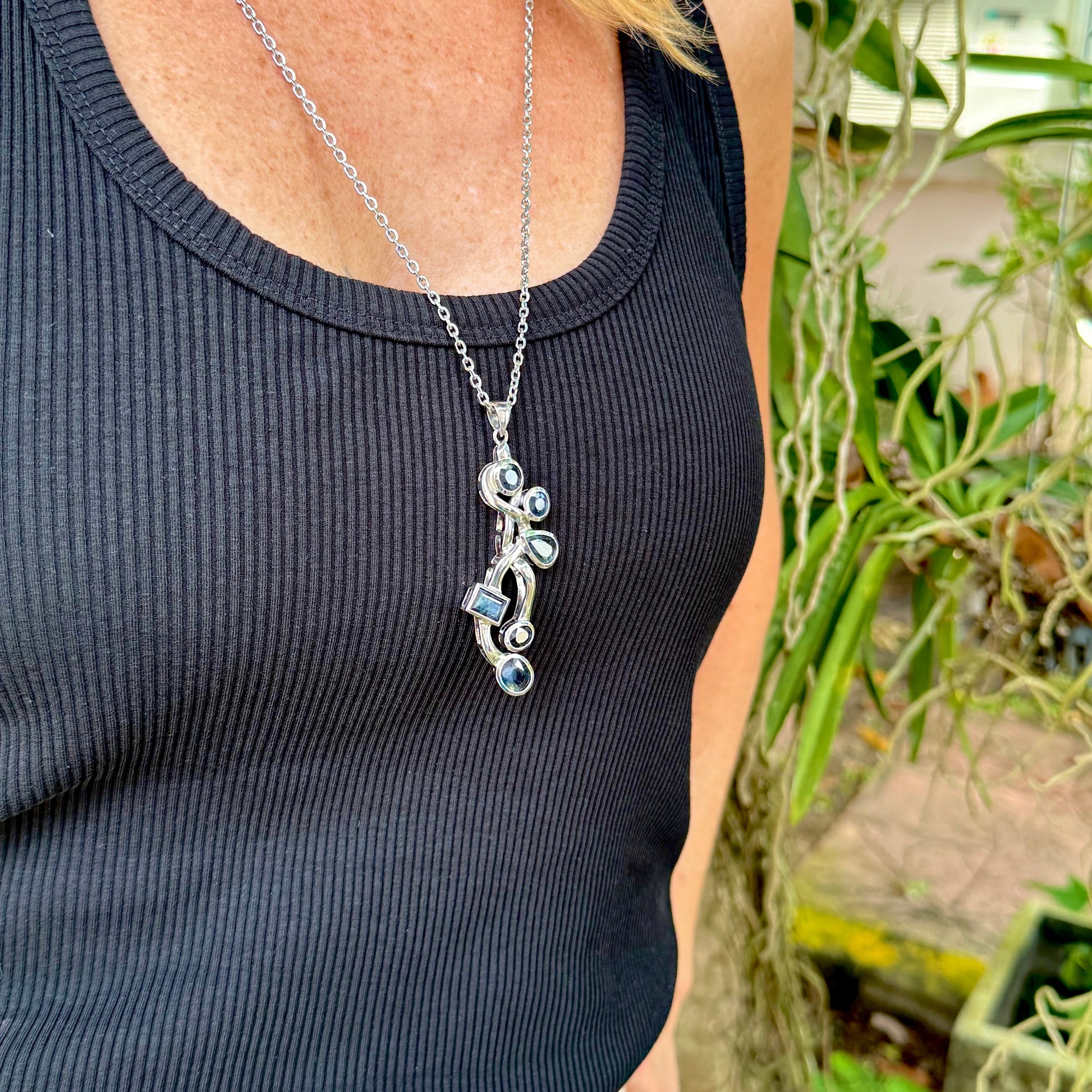 Handmade pendant with 14.68 ct natural blue sapphires set in white-gold-plated sterling silver.