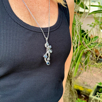 Handmade pendant with 14.68 ct natural blue sapphires set in white-gold-plated sterling silver.