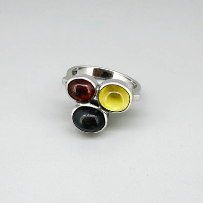 Handmade sterling silver ring with citrine, garnet and cat’s eye gemstones.