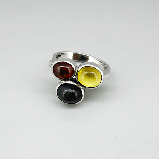 Handmade sterling silver ring with citrine, garnet and cat’s eye gemstones.