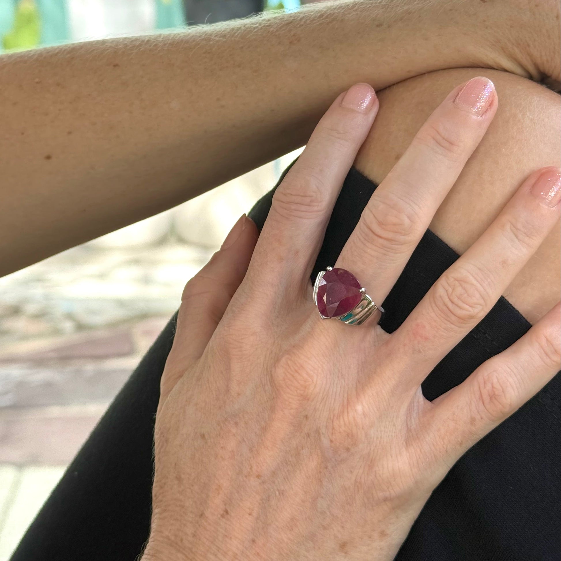 Ruby solitaire ring in white gold plated sterling silver, featuring a natural deep red gemstone, elegant and timeless design.