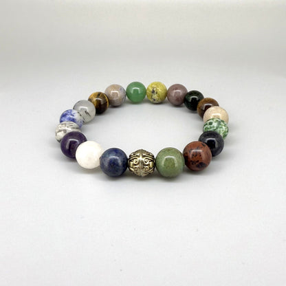 Multi-gemstone beaded bracelet, 18cm, with lapis lazuli, quartz, moonstone, amethyst, jasper, green fluorite, and rutilated quartz beads on elastic stretch band.