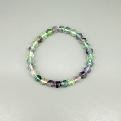 Fluorite beaded bracelet, 18cm, natural gemstone beads in mixed pastel tones on elastic stretch band.