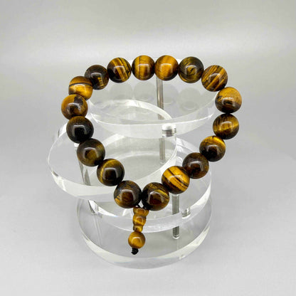 Tiger’s eye mala bracelet made from natural golden-brown tiger’s eye beads, symbolizing confidence, protection, and inner strength.