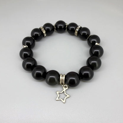 Obsidian beaded bracelet, 18cm, natural black gemstone beads with silver-toned star charm on elastic stretch band.